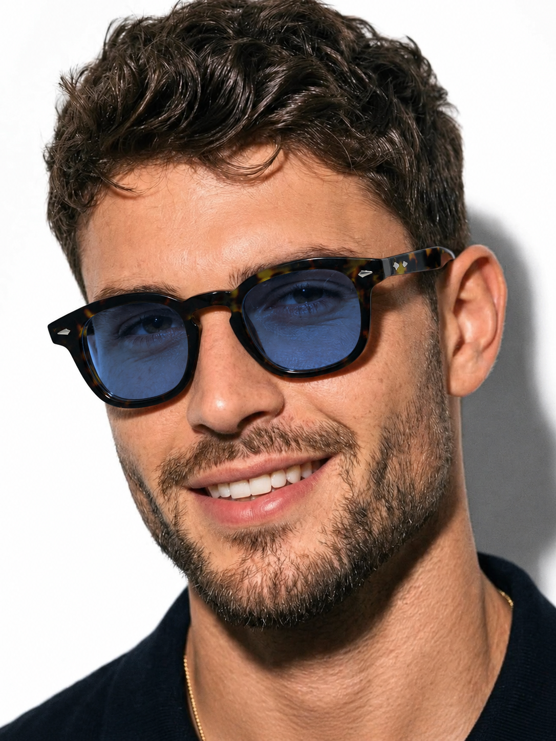 Light layers, quiet color, and frames that finish the outfit.